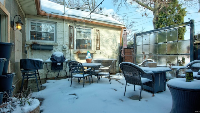 view of snow covered patio