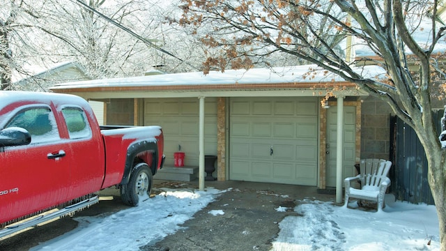 view of snow covered garage