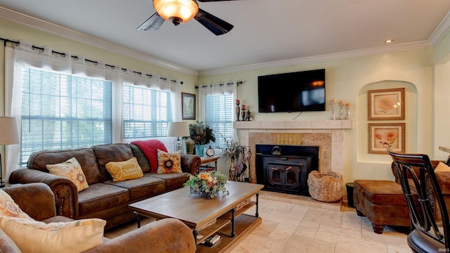 living room featuring light tile patterned floors, ceiling fan, and ornamental molding