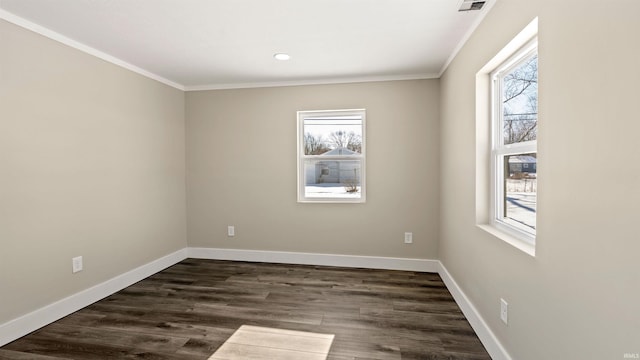 spare room with ornamental molding and dark wood-type flooring