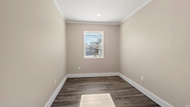 unfurnished room with crown molding and dark hardwood / wood-style flooring