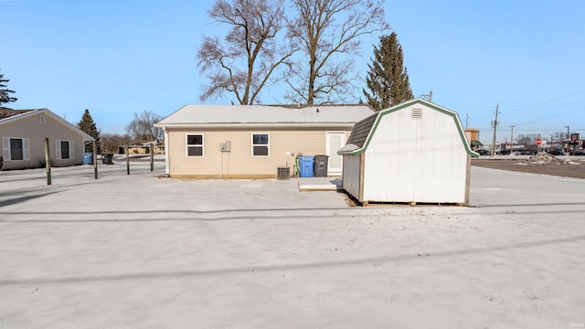 exterior space featuring a shed and central air condition unit