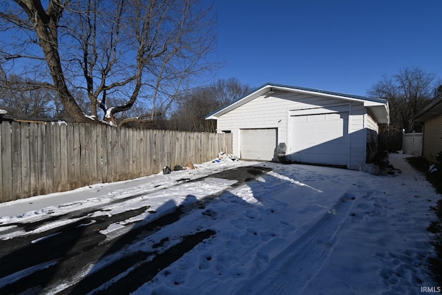 exterior space with a garage and an outdoor structure