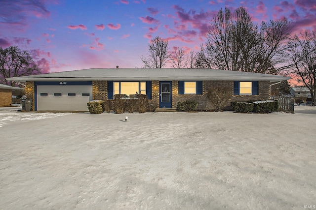 single story home featuring a garage