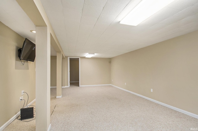 basement featuring light colored carpet