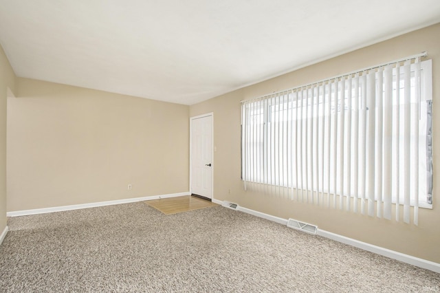 unfurnished room with carpet floors