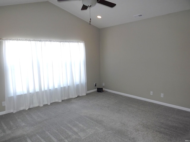 spare room with carpet, ceiling fan, and a wealth of natural light