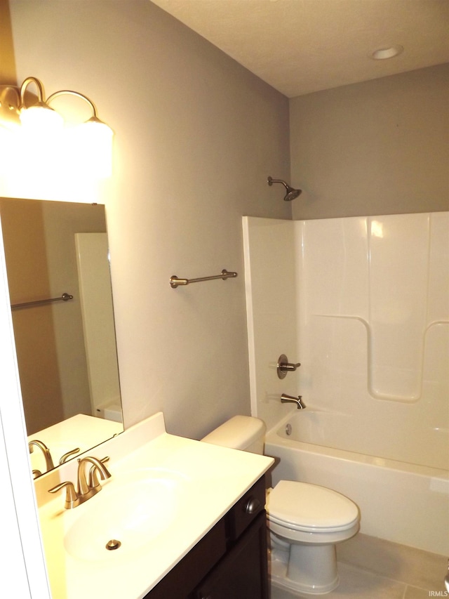 full bathroom with tile patterned floors, vanity, shower / bathing tub combination, and toilet