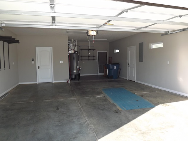 garage featuring electric panel, water heater, and a garage door opener