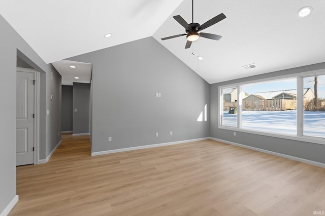unfurnished living room featuring light hardwood / wood-style flooring, vaulted ceiling, and ceiling fan