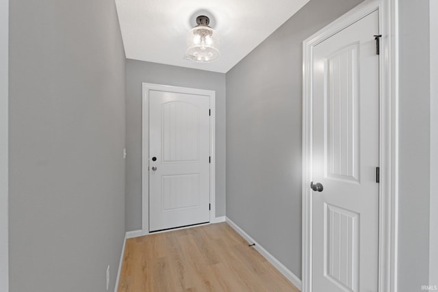 doorway with light wood-type flooring