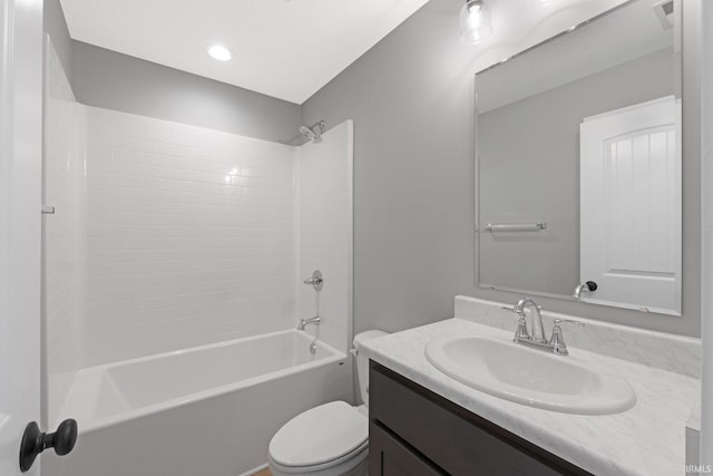 full bathroom featuring shower / tub combination, vanity, and toilet