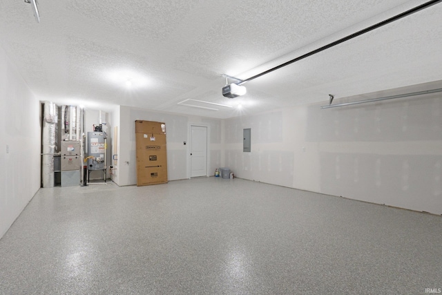 garage featuring electric panel, a garage door opener, heating unit, and water heater