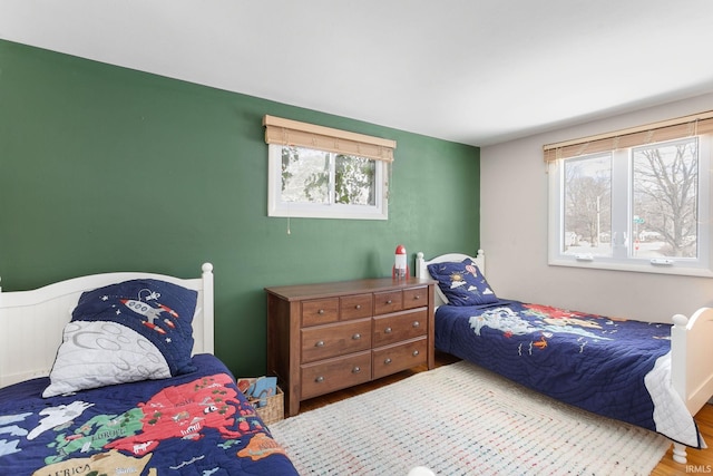 bedroom with hardwood / wood-style flooring