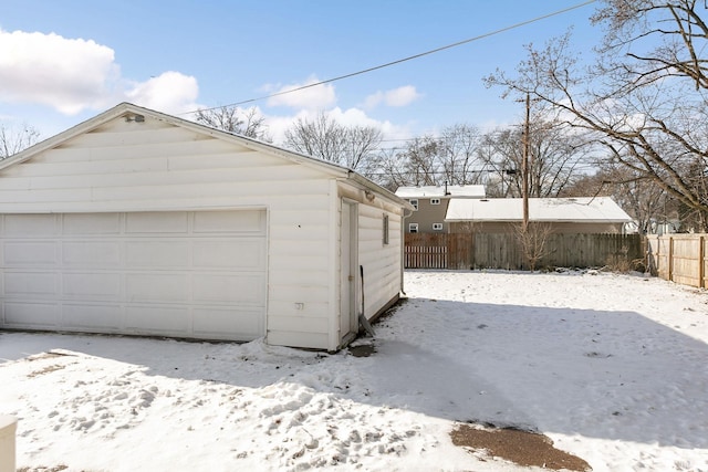 view of snow covered garage