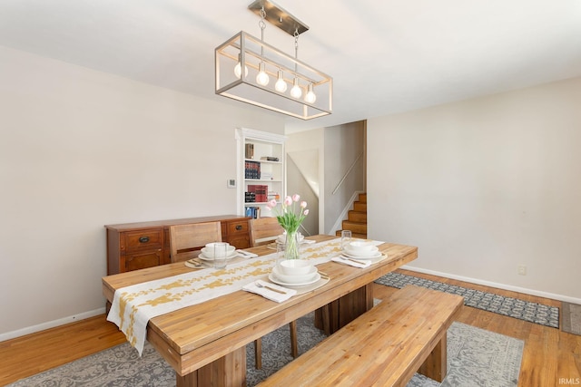 dining room with hardwood / wood-style flooring