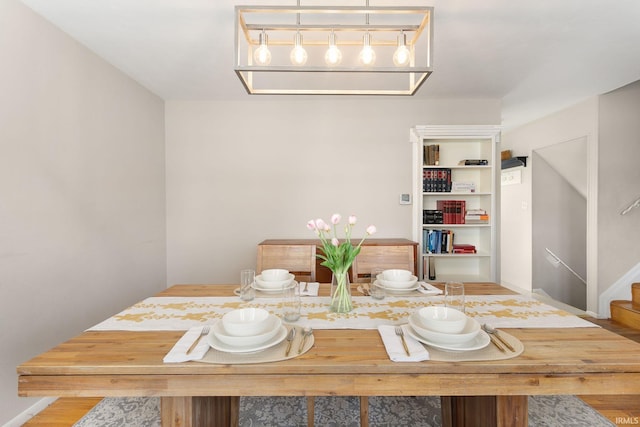 dining space with hardwood / wood-style flooring