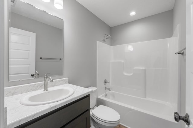 full bathroom with vanity, toilet, and bathing tub / shower combination