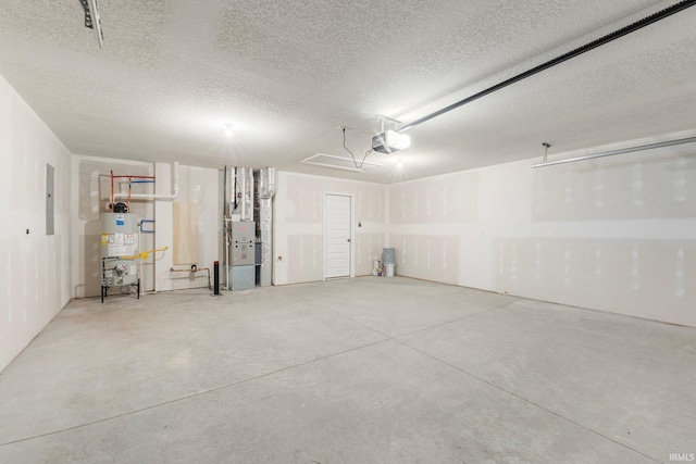 garage featuring electric panel, a garage door opener, heating unit, and water heater