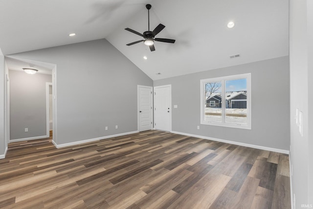 unfurnished living room featuring ceiling fan, dark hardwood / wood-style flooring, and lofted ceiling