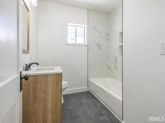 full bathroom featuring washtub / shower combination, vanity, and toilet