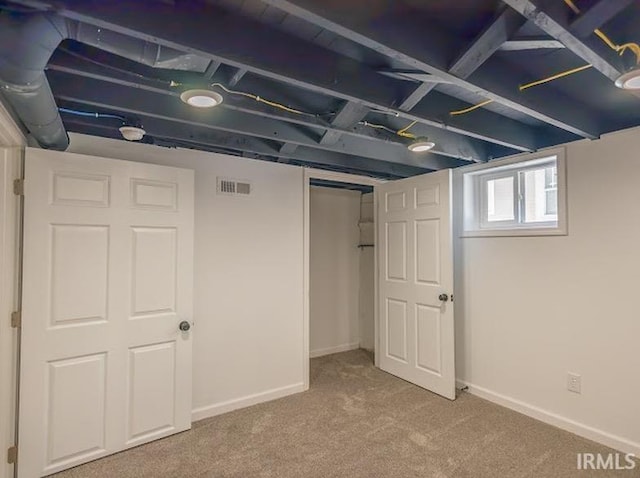 basement featuring carpet flooring