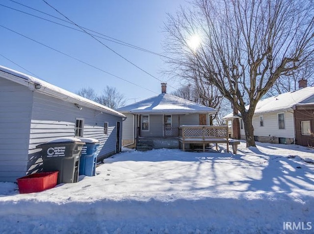 view of snow covered house