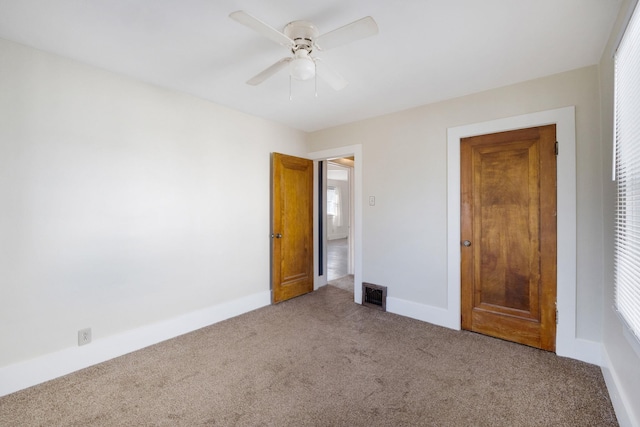 unfurnished bedroom with carpet and ceiling fan