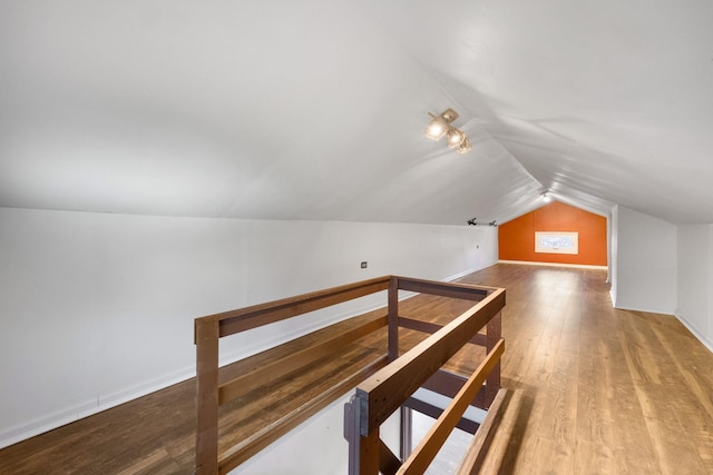 bonus room featuring hardwood / wood-style floors and vaulted ceiling