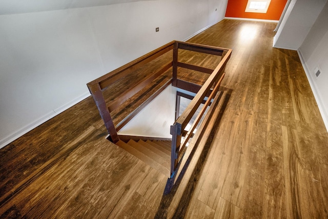 stairs with wood-type flooring