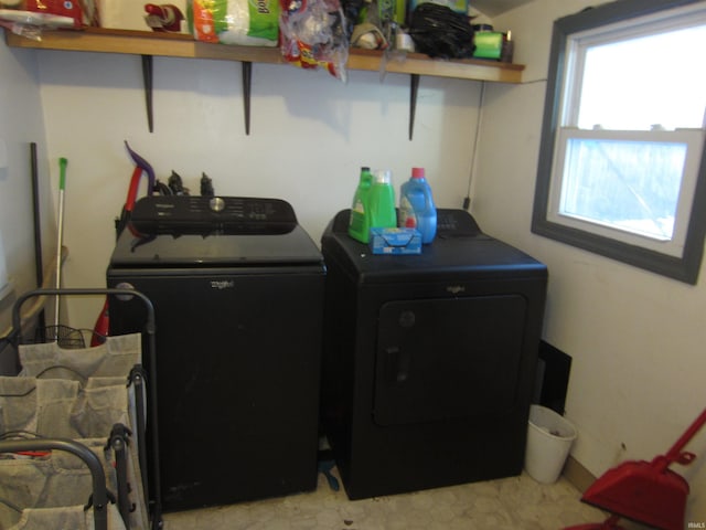 washroom with washing machine and clothes dryer