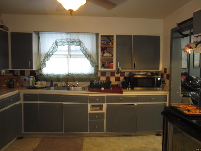 kitchen with ceiling fan and sink