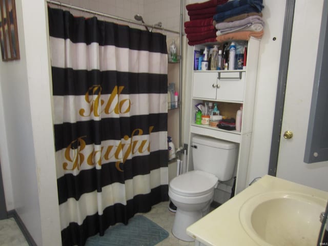 bathroom featuring vanity, toilet, and walk in shower