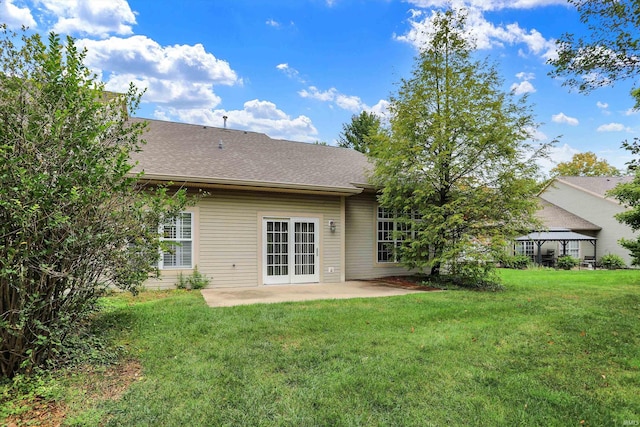 back of house featuring a gazebo, a lawn, and a patio