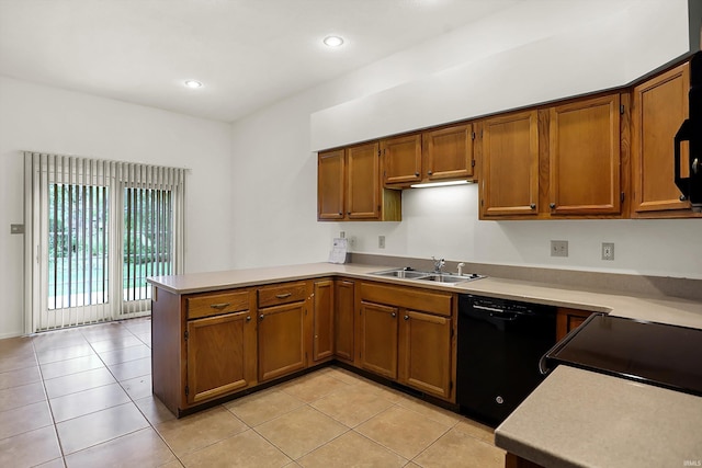 kitchen with kitchen peninsula, sink, light tile patterned floors, and black dishwasher