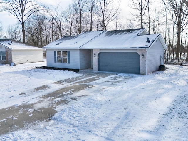 single story home featuring a garage