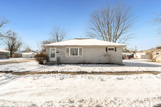 view of snow covered house