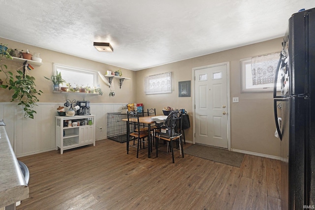 dining area featuring dark wood-type flooring