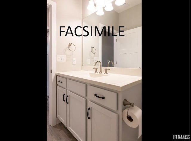 bathroom featuring vanity and hardwood / wood-style flooring