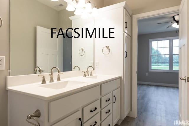 bathroom featuring vanity, hardwood / wood-style flooring, and ceiling fan