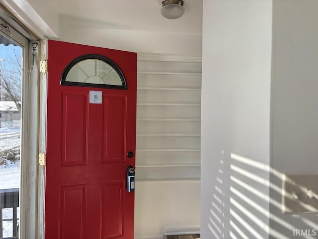 view of snow covered property entrance