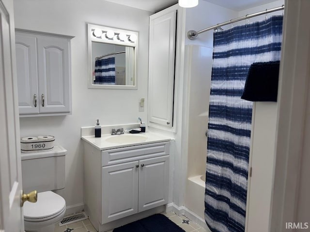 full bathroom featuring shower / tub combo with curtain, tile patterned floors, toilet, and vanity