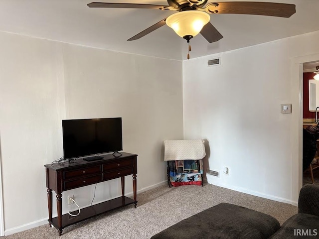 living room featuring light carpet and ceiling fan