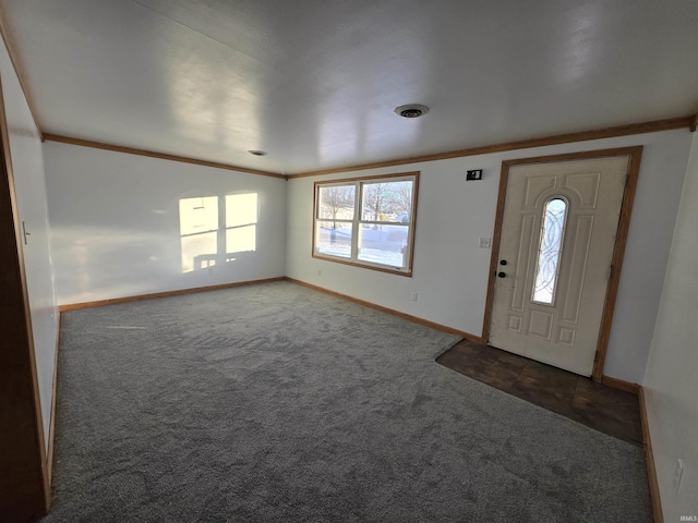 entrance foyer with carpet and ornamental molding