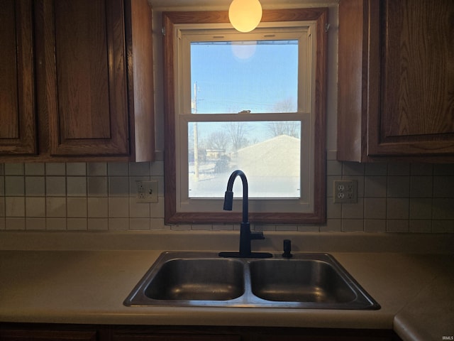 kitchen with backsplash and sink