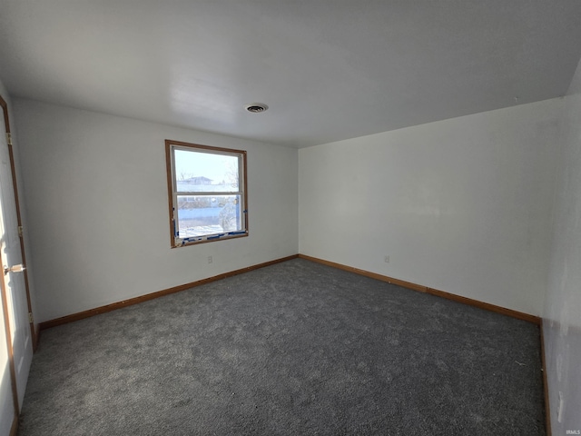 empty room with dark carpet