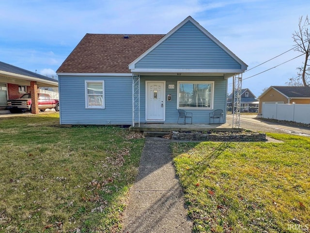 bungalow-style house featuring a porch and a front yard