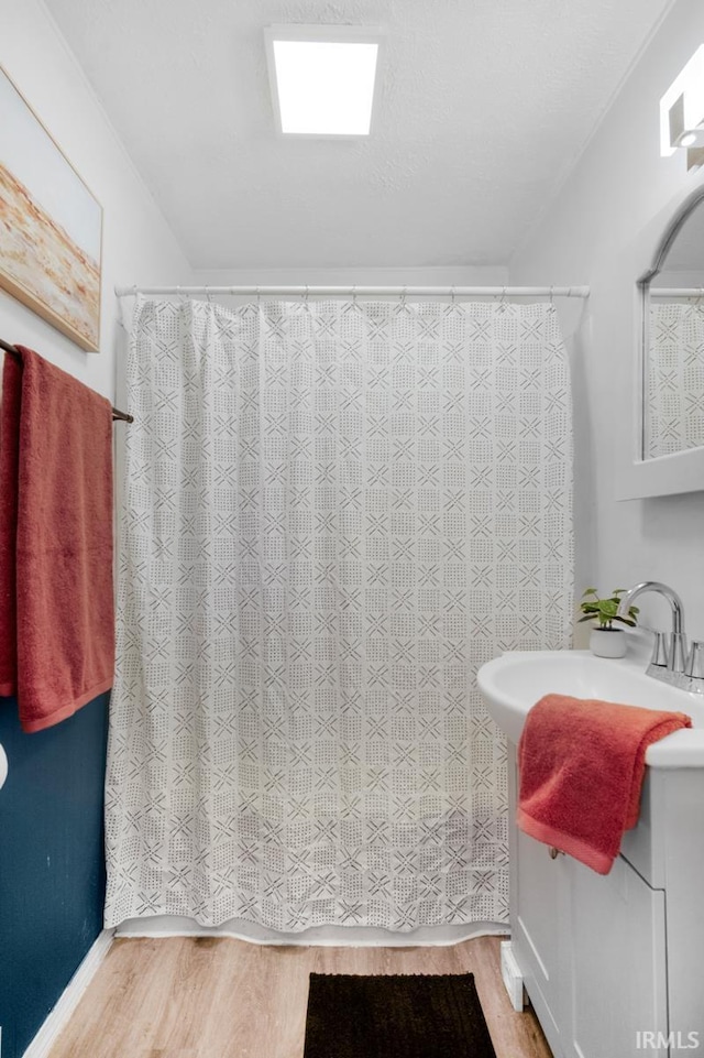 bathroom featuring hardwood / wood-style floors and sink