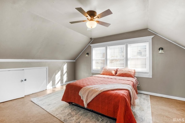 bedroom with ceiling fan, a closet, and vaulted ceiling