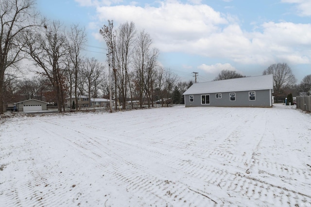 view of yard layered in snow